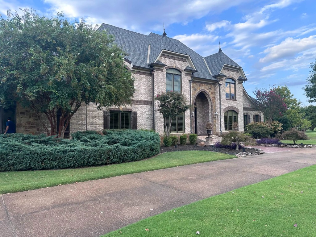 Estate driveway and landscaped front after property care